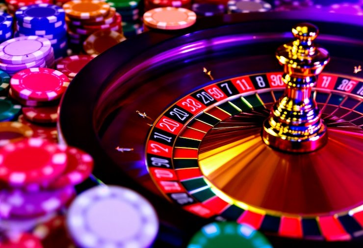 macan platform showing Liga 1 sportsbook, live-dealer table, and slot game lobby